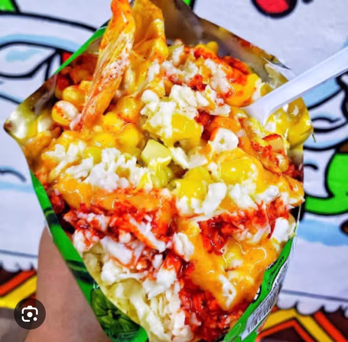 Tosti-Elote with corn toppings and chips